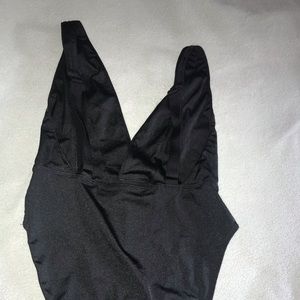 Out from under black bodysuit